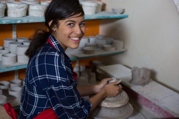 Young artist making pottery